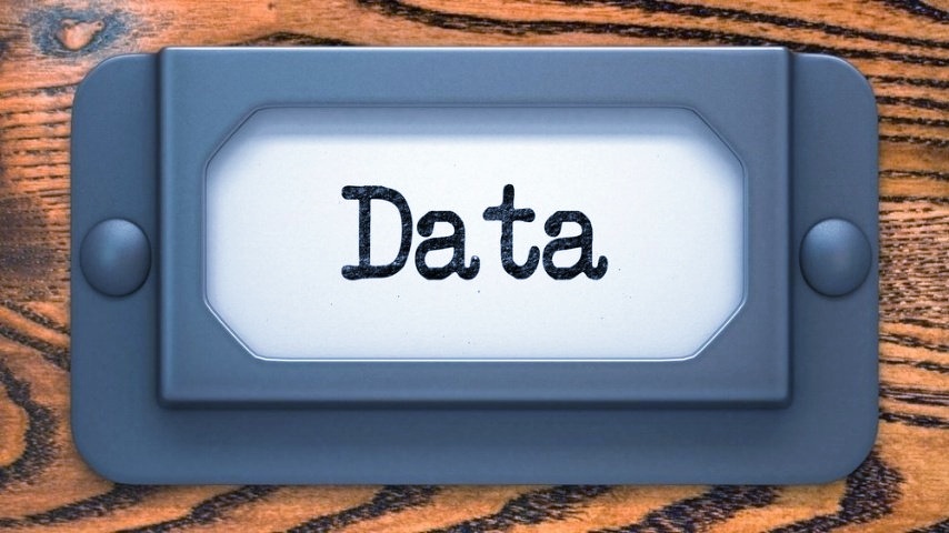Data Inscription on File Drawer Label on a Wooden Background.-140642-edited-209526-edited